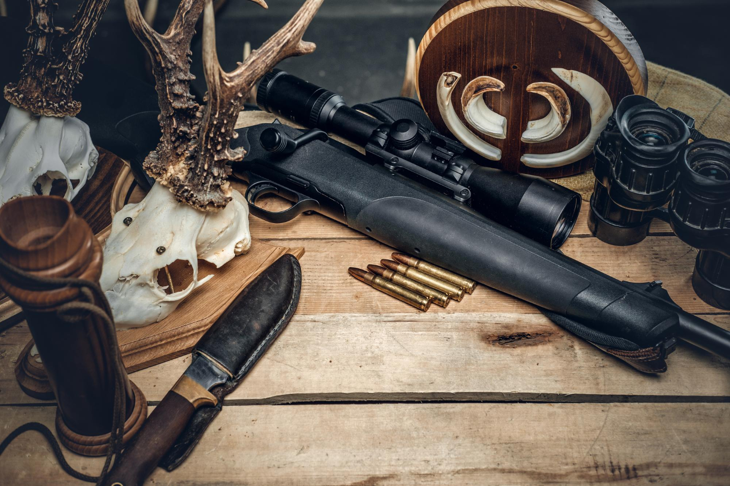 retro hunting ammunition rifle binoculars delicious sausage brown bread wooden table